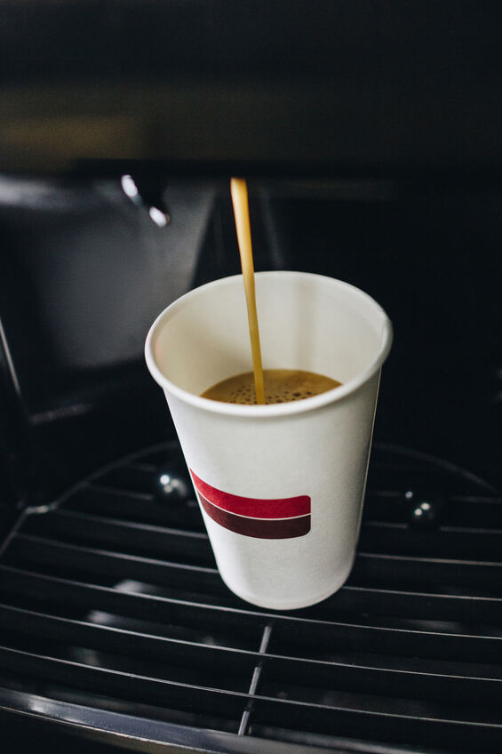 Coffee brewing from a vending machine into a paper cup